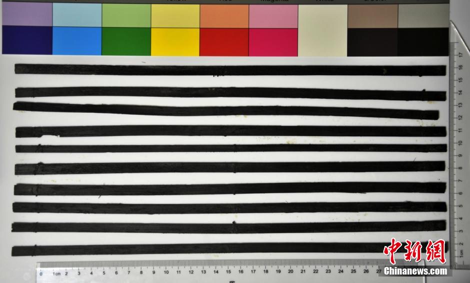 圖為漢代簡牘出土930支竹簡，在四川地區(qū)首次發(fā)現(xiàn)漢代簡牘。